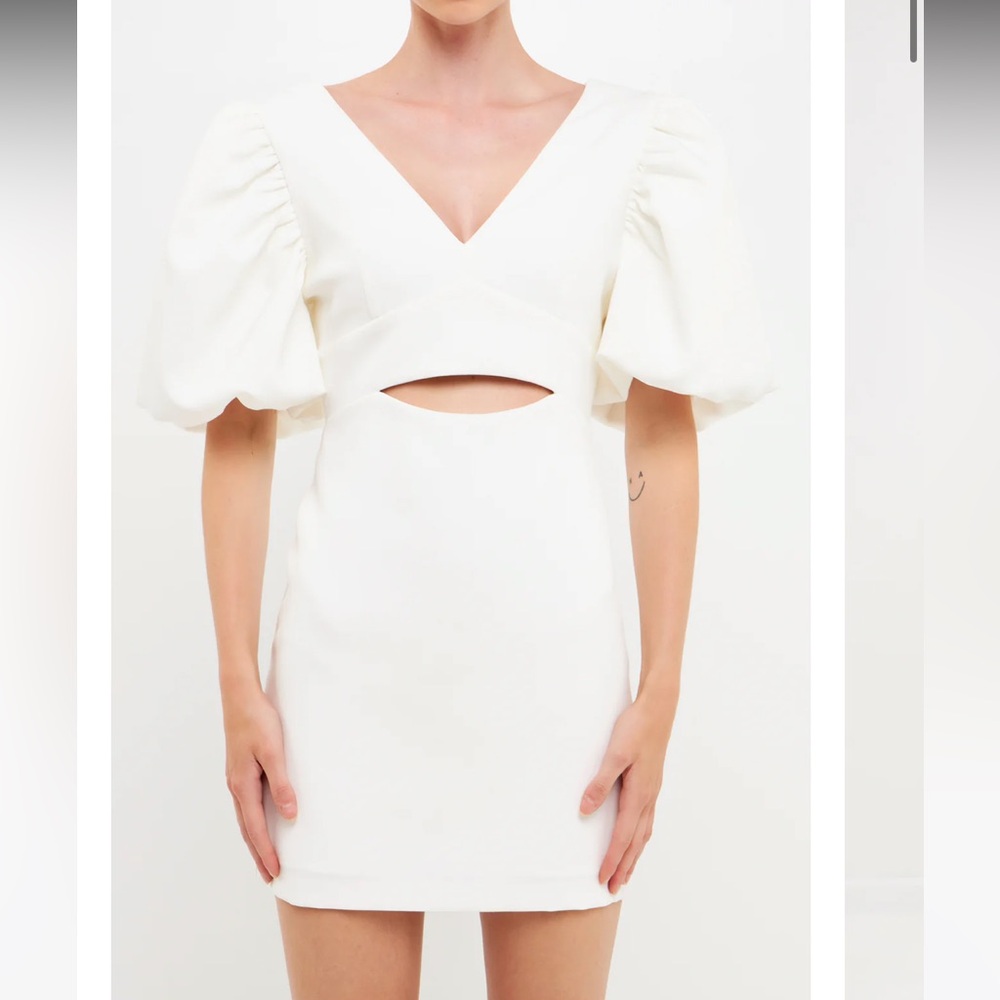White puff sleeved cut out mini dress